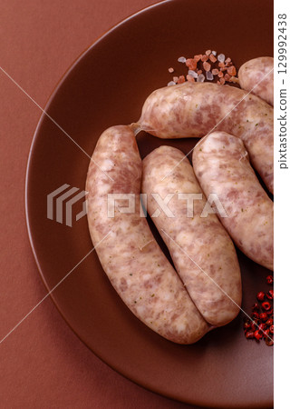 Raw meat sausages made from beef or pork, fresh meat for barbecuing or grilling. Raw sausages Raw meat sausages made from beef or pork, fresh meat for barbecuing or grilling. Raw sausages 129992438