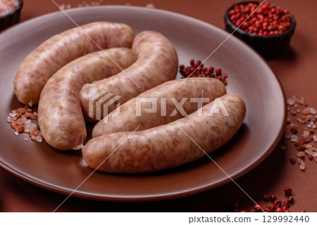 Raw meat sausages made from beef or pork, fresh meat for barbecuing or grilling. Raw sausages 129992440