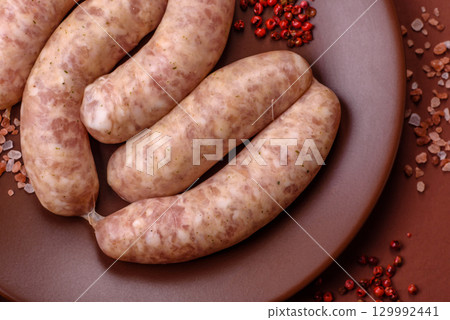 Raw meat sausages made from beef or pork, fresh meat for barbecuing or grilling. Raw sausages Raw meat sausages made from beef or pork, fresh meat for barbecuing or grilling. Raw sausages 129992441