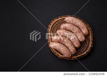 Raw meat sausages made from beef or pork, fresh meat for barbecuing or grilling. Raw sausages Raw meat sausages made from beef or pork, fresh meat for barbecuing or grilling. Raw sausages 129992449