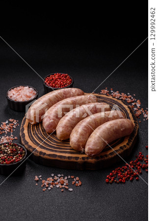 Raw meat sausages made from beef or pork, fresh meat for barbecuing or grilling. Raw sausages Raw meat sausages made from beef or pork, fresh meat for barbecuing or grilling. Raw sausages 129992462