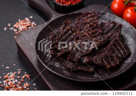 Snacks or jerky, beef slice meat dried, dehydrated. Beef snack Snacks or jerky, beef slice meat dried, dehydrated. Beef snack 129992511