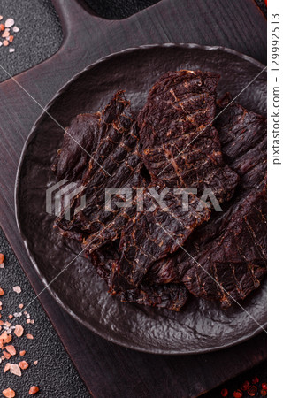 Snacks or jerky, beef slice meat dried, dehydrated. Beef snack Snacks or jerky, beef slice meat dried, dehydrated. Beef snack 129992513