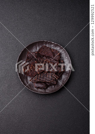 Snacks or jerky, beef slice meat dried, dehydrated. Beef snack Snacks or jerky, beef slice meat dried, dehydrated. Beef snack 129992521