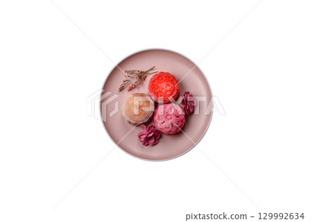 Chinese mooncake is an Asian sweet dessert. Asian mooncake as a background for your design 129992634