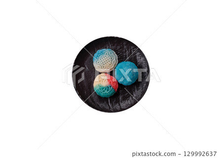 Chinese mooncake is an Asian sweet dessert. Asian mooncake as a background for your design 129992637