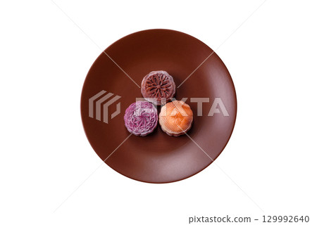 Chinese mooncake is an Asian sweet dessert. Asian mooncake as a background for your design 129992640