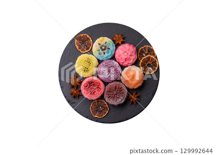 Chinese mooncake is an Asian sweet dessert. Asian mooncake as a background for your design Chinese mooncake is an Asian sweet dessert. Asian mooncake as a background for your design 129992644