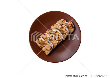 Christmas Stollen, a German sweet cake with marzipan and fruit. Winter Christmas Stollen 129992656