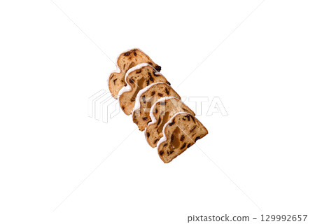 Christmas Stollen, a German sweet cake with marzipan and fruit. Winter Christmas Stollen 129992657