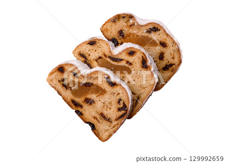 Christmas Stollen, a German sweet cake with marzipan and fruit. Winter Christmas Stollen 129992659