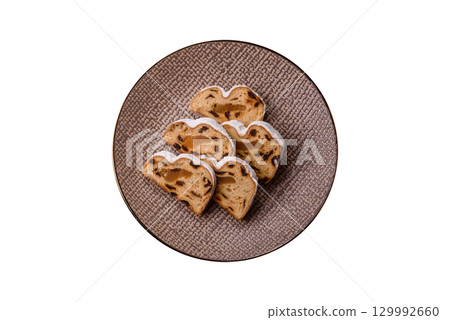 Christmas Stollen, a German sweet cake with marzipan and fruit. Winter Christmas Stollen 129992660