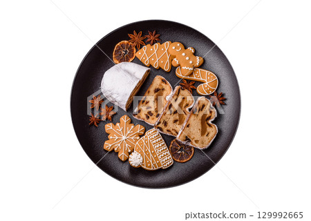 Christmas Stollen, a German sweet cake with marzipan and fruit. Winter Christmas Stollen 129992665