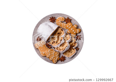 Christmas Stollen, a German sweet cake with marzipan and fruit. Winter Christmas Stollen 129992667