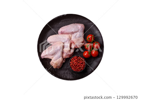 Raw chicken wings, fresh uncooked poultry meat. Chicken or turkey wings Raw chicken wings, fresh uncooked poultry meat. Chicken or turkey wings 129992670
