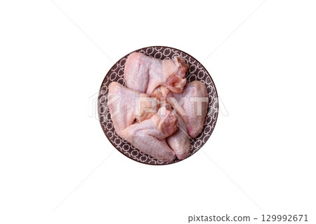 Raw chicken wings, fresh uncooked poultry meat. Chicken or turkey wings Raw chicken wings, fresh uncooked poultry meat. Chicken or turkey wings 129992671