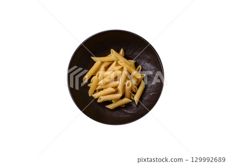 Penne pasta cooked with cheese, salt and spices. Italian food penne pasta 129992689