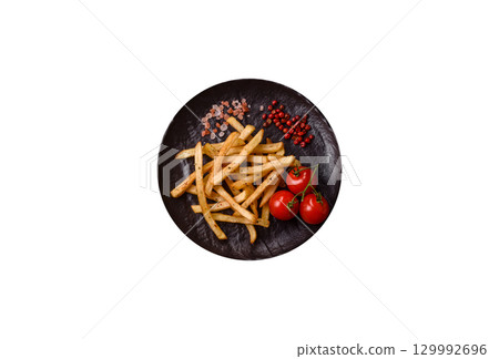 Food, French fries fried with salt and rosemary. Homemade crispy chips Food, French fries fried with salt and rosemary. Homemade crispy chips 129992696