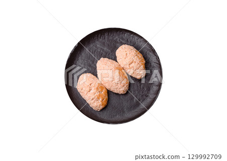 Steamed fish or chicken cutlets or meatballs with salt and spices. Fish cutlets 129992709
