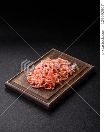 Food, dried squid in shavings or chopped as snacks or jerky. Snack dried squid for beer 129992907