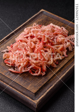 Food, dried squid in shavings or chopped as snacks or jerky. Snack dried squid for beer Food, dried squid in shavings or chopped as snacks or jerky. Snack dried squid for beer 129992911