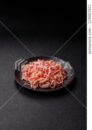 Food, dried squid in shavings or chopped as snacks or jerky. Snack dried squid for beer Food, dried squid in shavings or chopped as snacks or jerky. Snack dried squid for beer 129992921