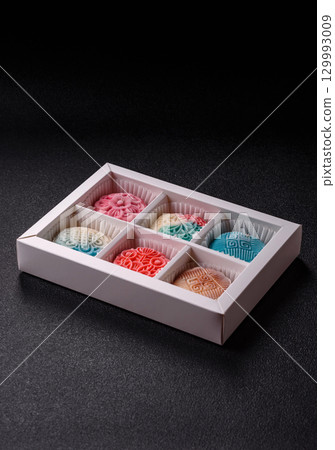 Chinese mooncake is an Asian sweet dessert. Asian mooncake as a background for your design Chinese mooncake is an Asian sweet dessert. Asian mooncake as a background for your design 129993009