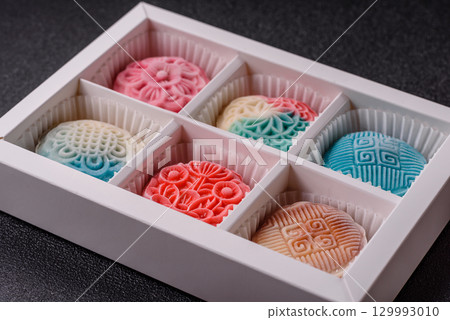 Chinese mooncake is an Asian sweet dessert. Asian mooncake as a background for your design 129993010