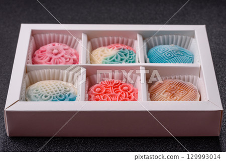 Chinese mooncake is an Asian sweet dessert. Asian mooncake as a background for your design Chinese mooncake is an Asian sweet dessert. Asian mooncake as a background for your design 129993014