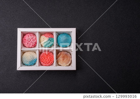 Chinese mooncake is an Asian sweet dessert. Asian mooncake as a background for your design Chinese mooncake is an Asian sweet dessert. Asian mooncake as a background for your design 129993016