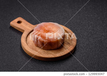 Chinese mooncake is an Asian sweet dessert. Asian mooncake as a background for your design 129993047