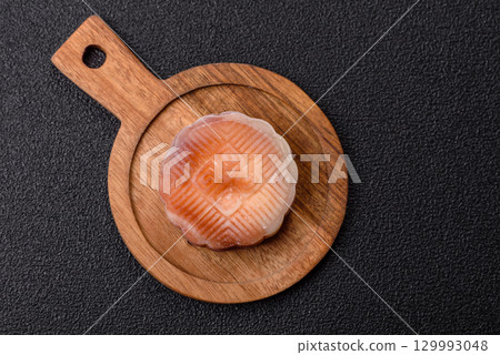 Chinese mooncake is an Asian sweet dessert. Asian mooncake as a background for your design Chinese mooncake is an Asian sweet dessert. Asian mooncake as a background for your design 129993048