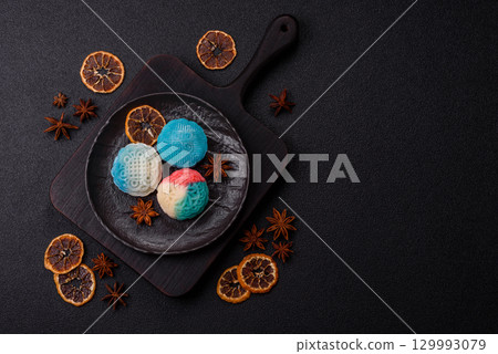 Chinese mooncake is an Asian sweet dessert. Asian mooncake as a background for your design 129993079