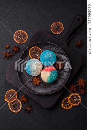 Chinese mooncake is an Asian sweet dessert. Asian mooncake as a background for your design 129993080