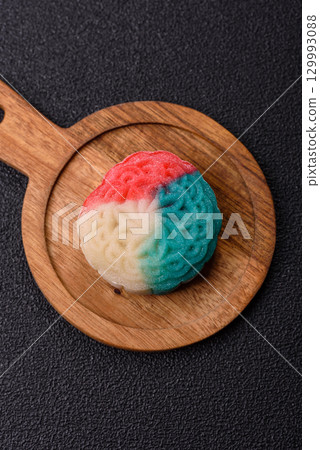 Chinese mooncake is an Asian sweet dessert. Asian mooncake as a background for your design 129993088