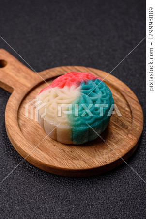 Chinese mooncake is an Asian sweet dessert. Asian mooncake as a background for your design Chinese mooncake is an Asian sweet dessert. Asian mooncake as a background for your design 129993089