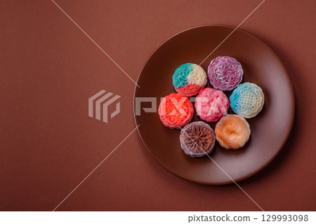 Chinese mooncake is an Asian sweet dessert. Asian mooncake as a background for your design Chinese mooncake is an Asian sweet dessert. Asian mooncake as a background for your design 129993098
