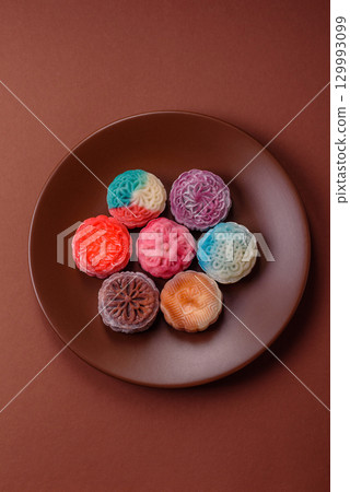 Chinese mooncake is an Asian sweet dessert. Asian mooncake as a background for your design Chinese mooncake is an Asian sweet dessert. Asian mooncake as a background for your design 129993099