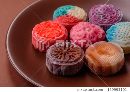 Chinese mooncake is an Asian sweet dessert. Asian mooncake as a background for your design 129993101