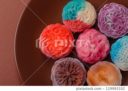 Chinese mooncake is an Asian sweet dessert. Asian mooncake as a background for your design 129993102