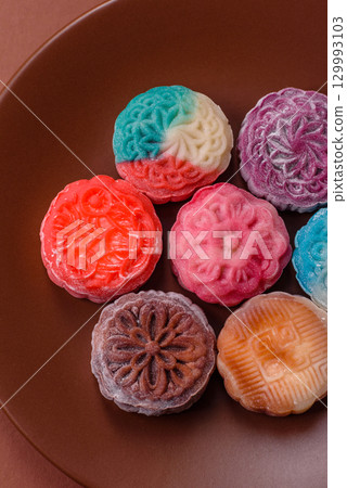 Chinese mooncake is an Asian sweet dessert. Asian mooncake as a background for your design Chinese mooncake is an Asian sweet dessert. Asian mooncake as a background for your design 129993103