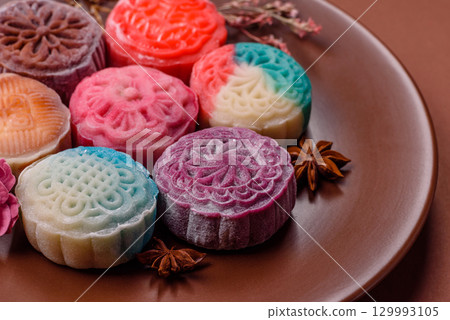 Chinese mooncake is an Asian sweet dessert. Asian mooncake as a background for your design 129993105