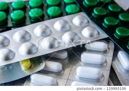 Much medical pills and drugs in silber and green package. Healthcare concept. Much medical pills and drugs in silber and green package. Healthcare concept. 129993106