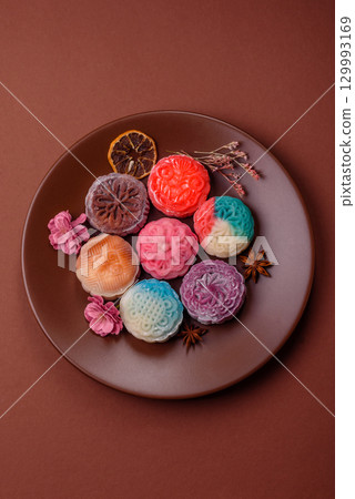 Chinese mooncake is an Asian sweet dessert. Asian mooncake as a background for your design Chinese mooncake is an Asian sweet dessert. Asian mooncake as a background for your design 129993169