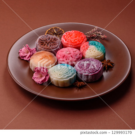 Chinese mooncake is an Asian sweet dessert. Asian mooncake as a background for your design 129993170
