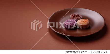 Chinese mooncake is an Asian sweet dessert. Asian mooncake as a background for your design 129993171
