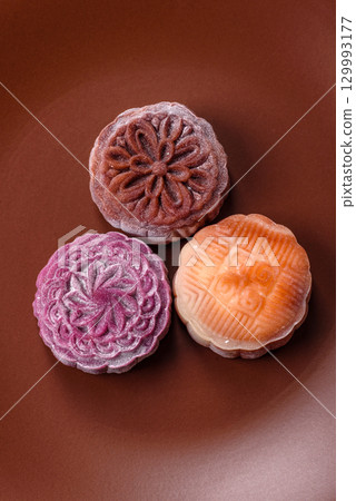 Chinese mooncake is an Asian sweet dessert. Asian mooncake as a background for your design 129993177