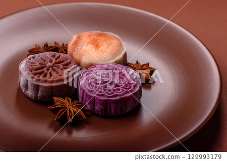 Chinese mooncake is an Asian sweet dessert. Asian mooncake as a background for your design Chinese mooncake is an Asian sweet dessert. Asian mooncake as a background for your design 129993179