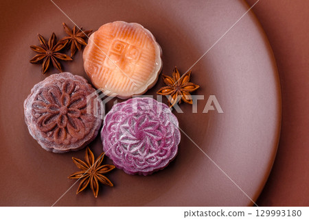 Chinese mooncake is an Asian sweet dessert. Asian mooncake as a background for your design 129993180