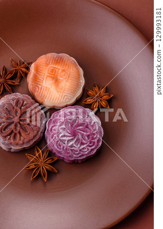 Chinese mooncake is an Asian sweet dessert. Asian mooncake as a background for your design Chinese mooncake is an Asian sweet dessert. Asian mooncake as a background for your design 129993181